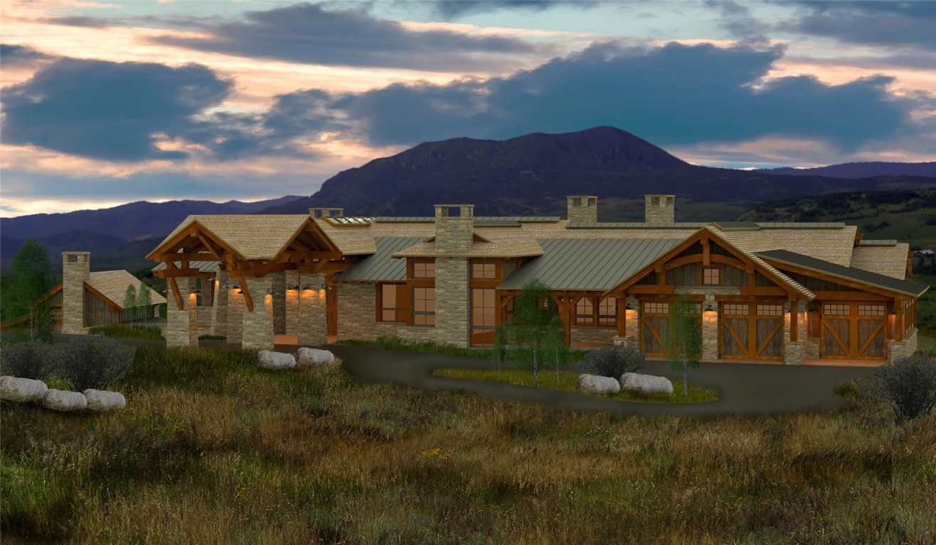 27105 Cowboy Up Road Steamboat Springs, CO 80487 - Photo 6 of 28 a front view of a house with a yard