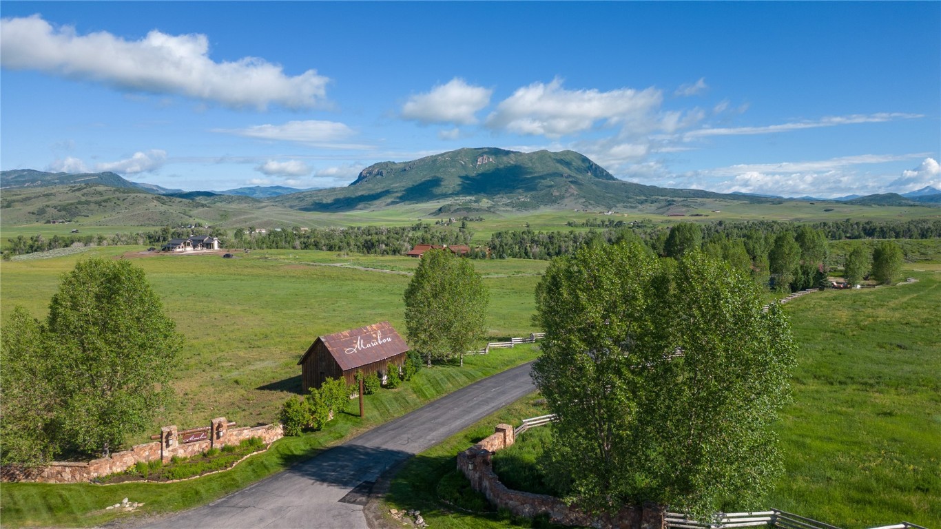 27105 Cowboy Up Road Steamboat Springs, CO 80487 - Photo 8 of 28 a view of a lake with a yard
