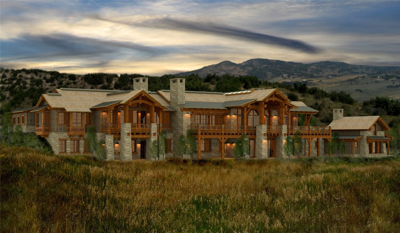 27105 Cowboy Up Road Steamboat Springs, CO 80487 - Photo 9 of 28 a view of a large house with a big yard and large trees