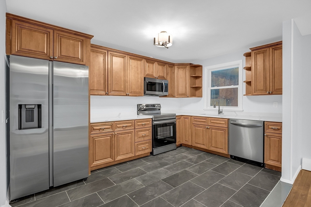 57 East Princeton Road Princeton, MA 01541 - Photo 4 of 30 a kitchen with stainless steel appliances granite countertop a refrigerator sink and stove