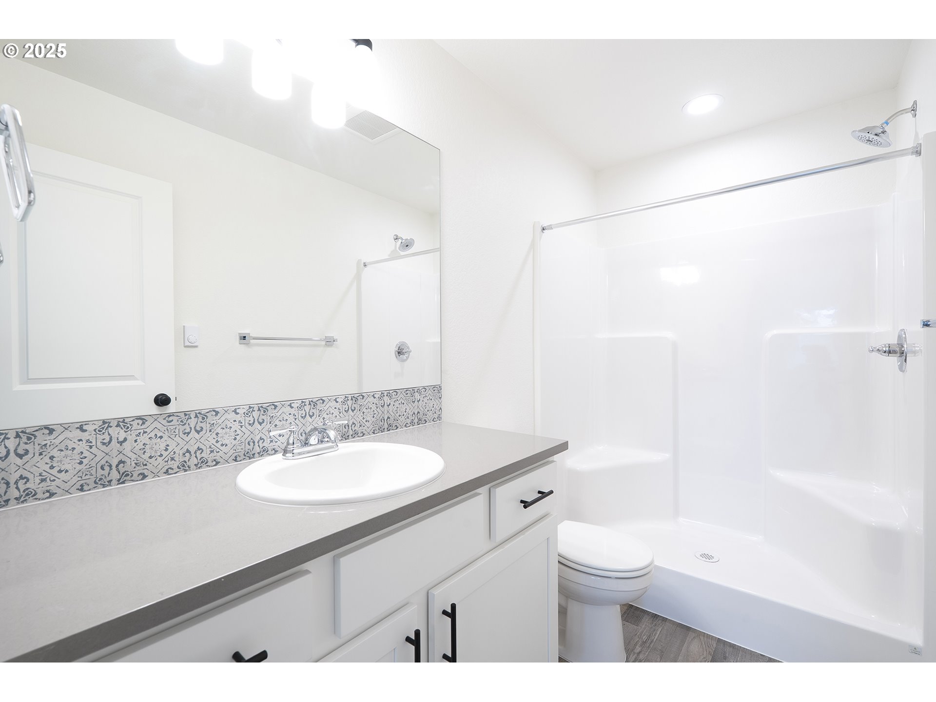 14722 Southeast Powell Boulevard Portland, OR 97236 - Photo 13 of 20 a bathroom with a sink a toilet and shower