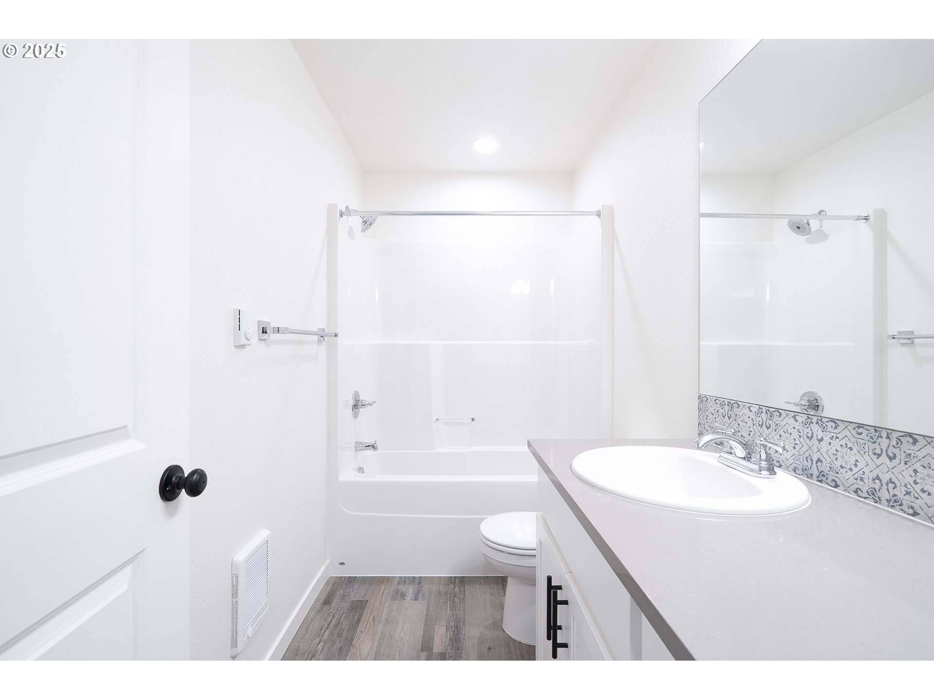 14722 Southeast Powell Boulevard Portland, OR 97236 - Photo 16 of 20 a bathroom with a sink a toilet a shower and a mirror
