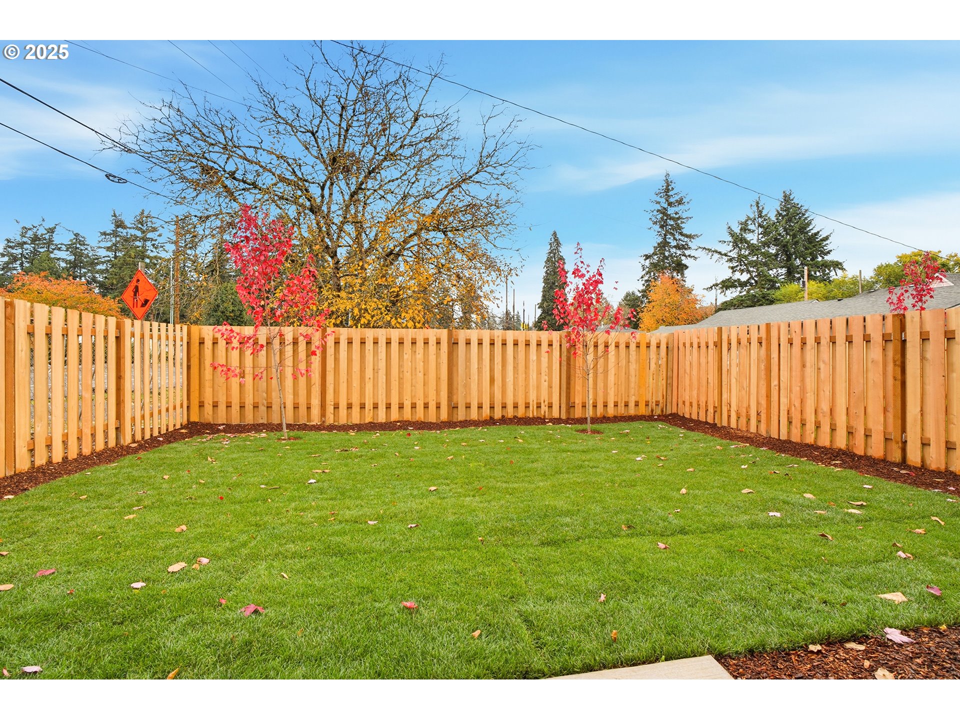 14722 Southeast Powell Boulevard Portland, OR 97236 - Photo 19 of 20 a view of a yard with wooden fence