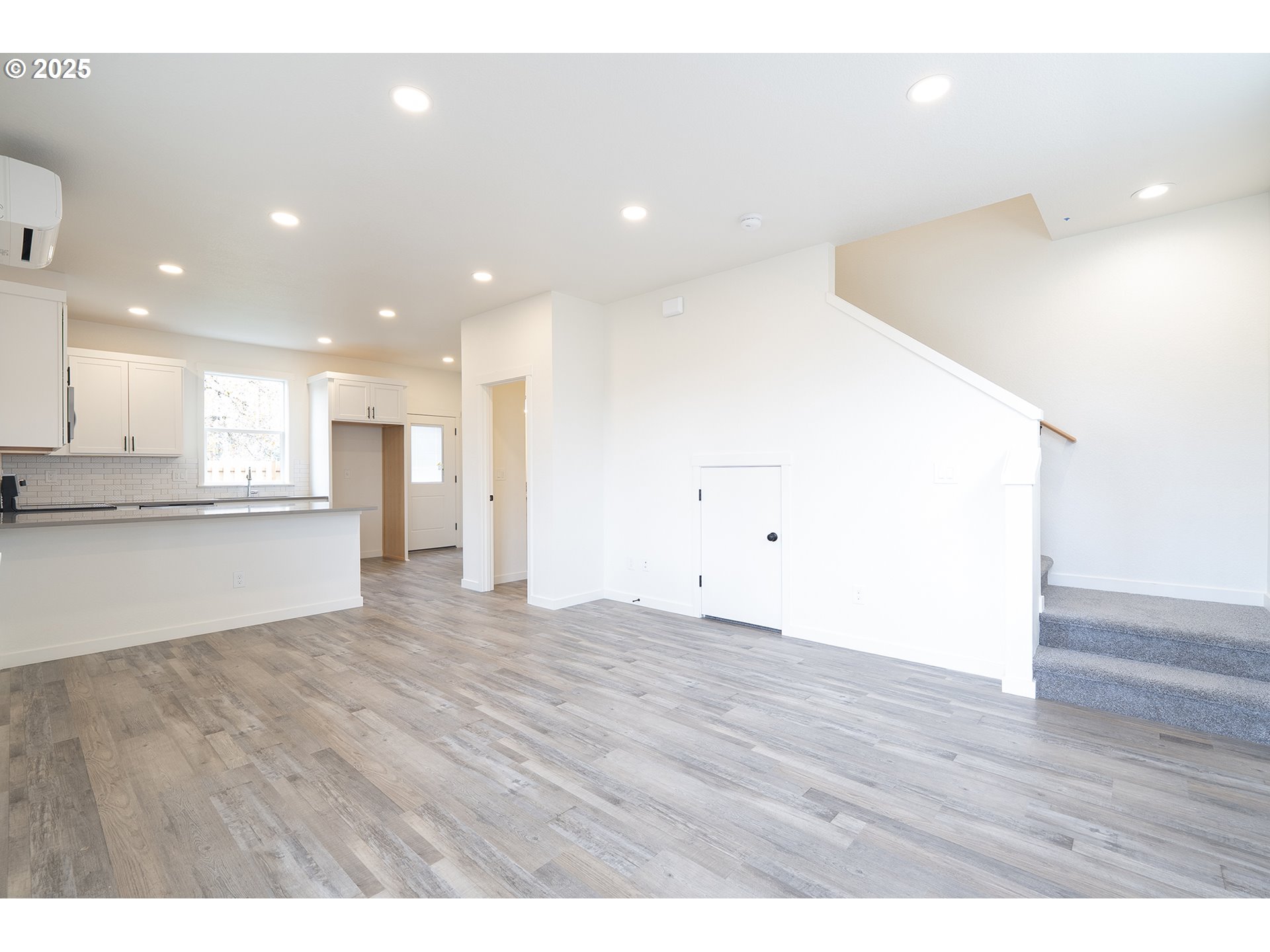 14722 Southeast Powell Boulevard Portland, OR 97236 - Photo 4 of 20 a view of an empty room with wooden floor