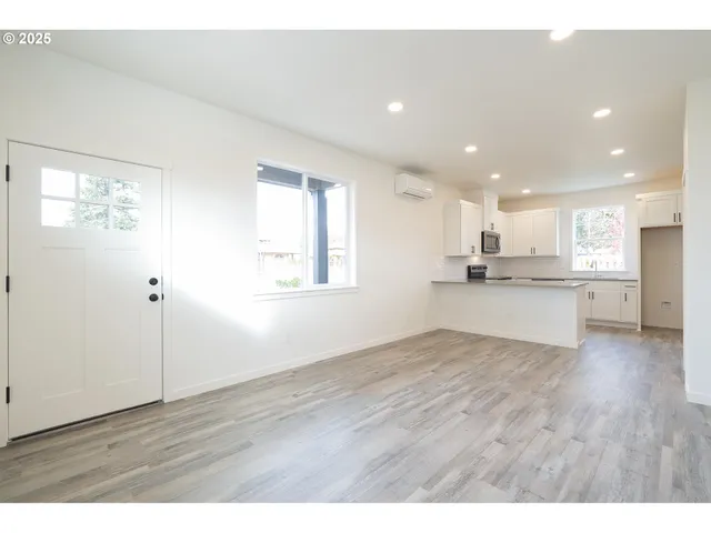 a view of kitchen with wooden floor