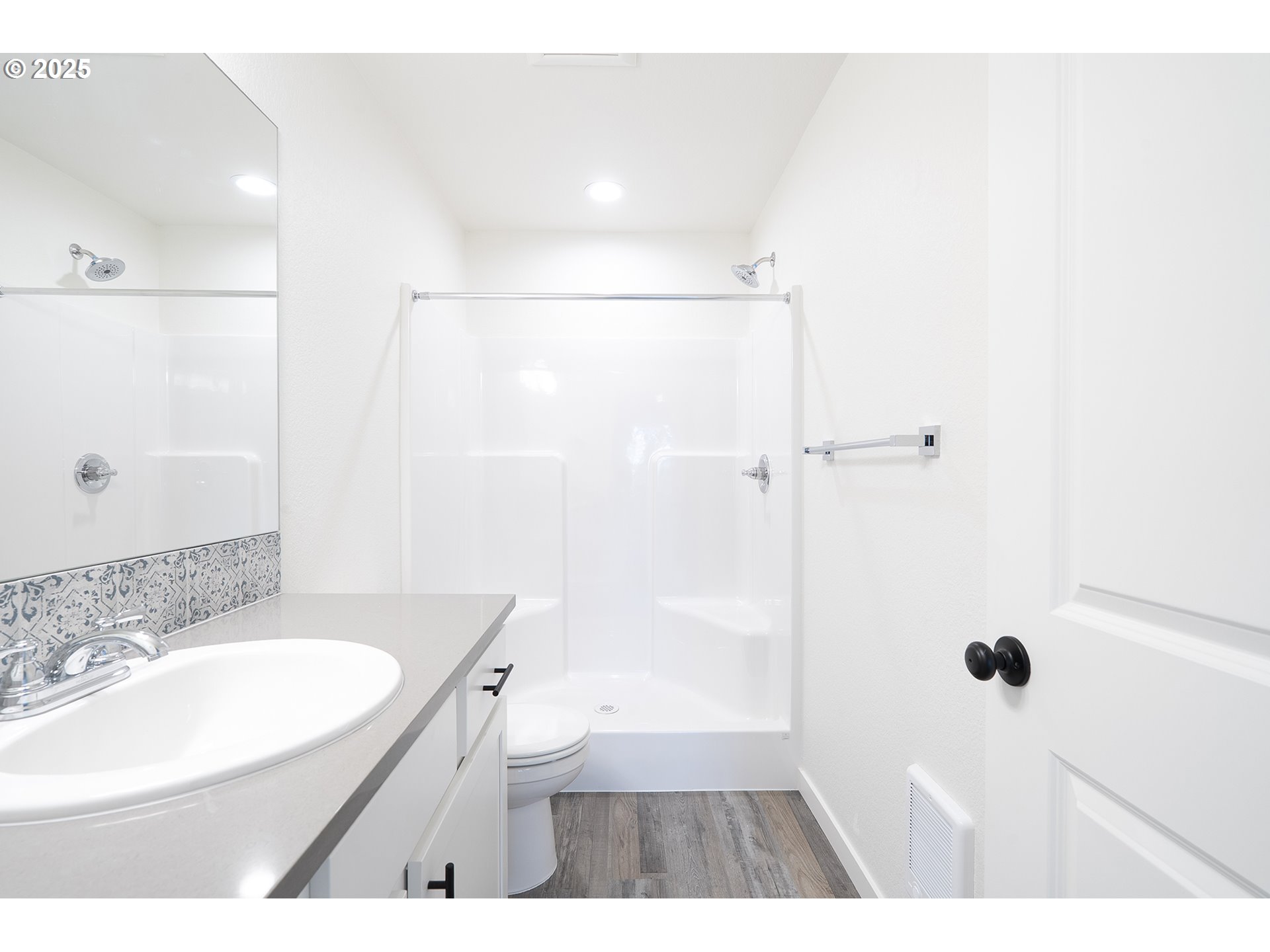 14722 Southeast Powell Boulevard Portland, OR 97236 - Photo 9 of 20 a bathroom with a sink a toilet a shower and a mirror