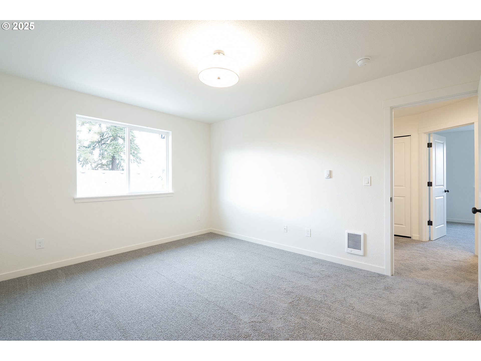 14722 Southeast Powell Boulevard Portland, OR 97236 - Photo 10 of 20 a view of an empty room with a window