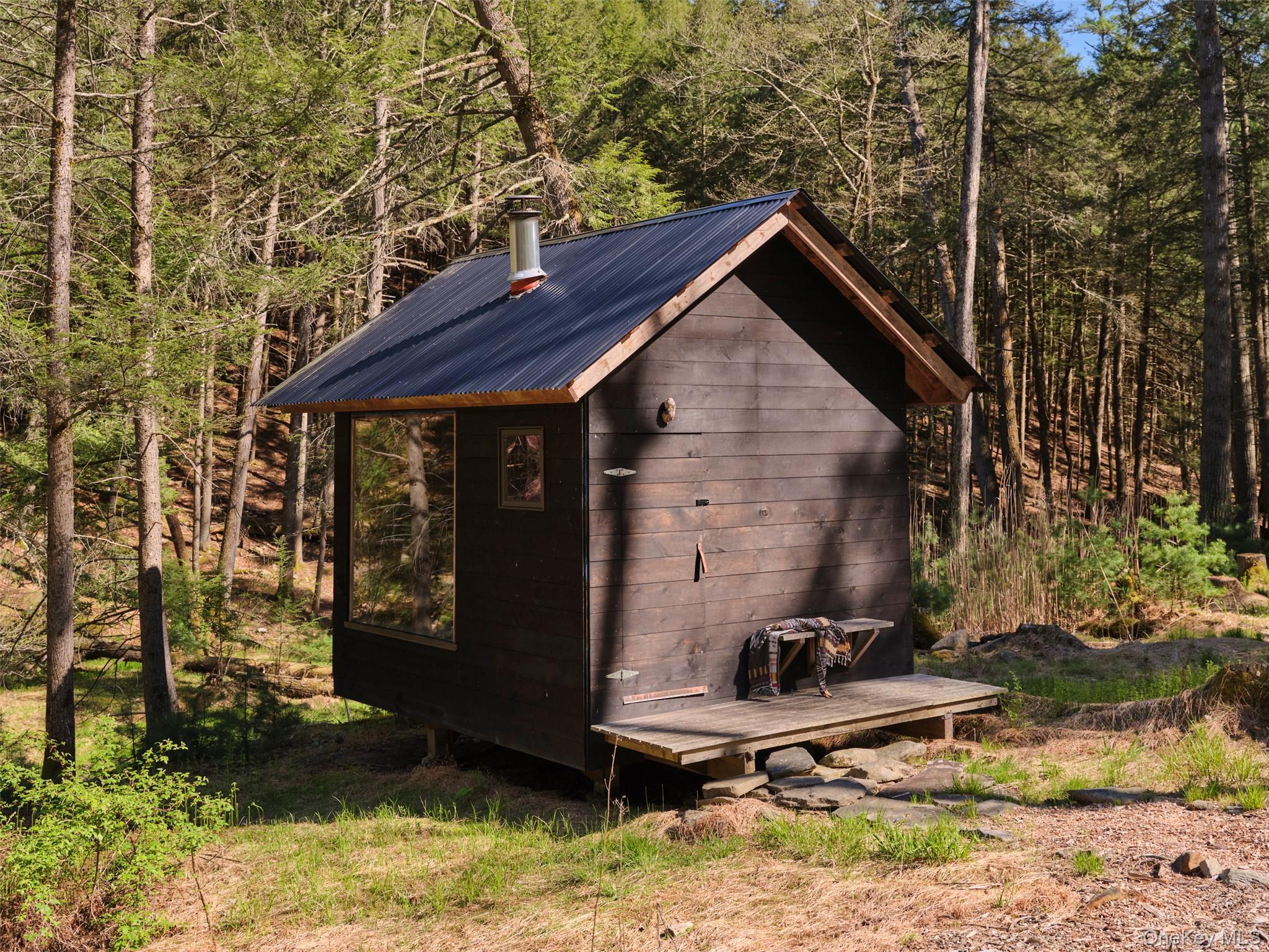55 Woods Road Barryville, NY 12719 - Photo 13 of 50 a house view with a backyard space