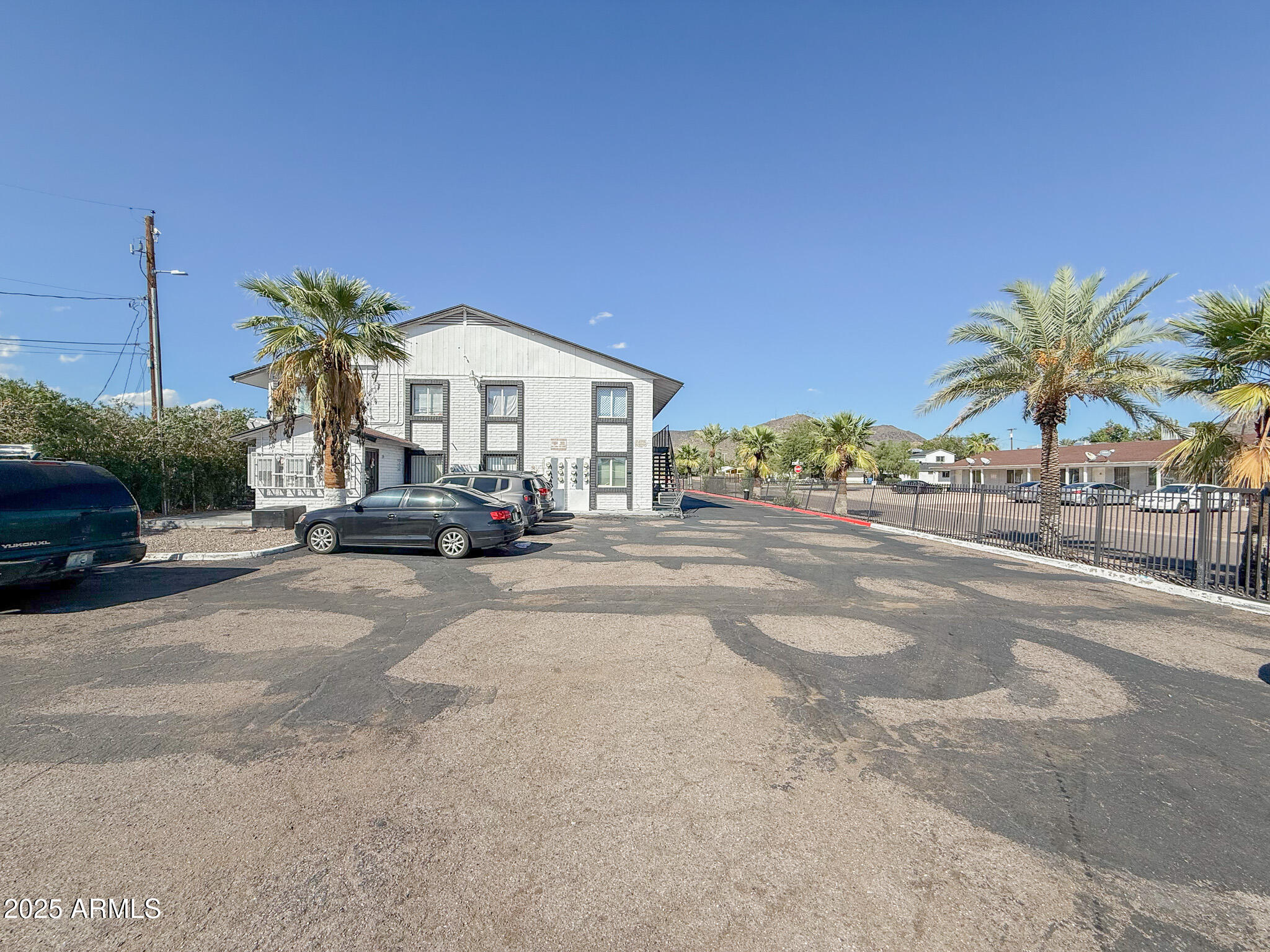 1703 West Mountain View Road, Unit 11 Phoenix, AZ 85021 - Photo 2 of 12 a view of a street with cars
