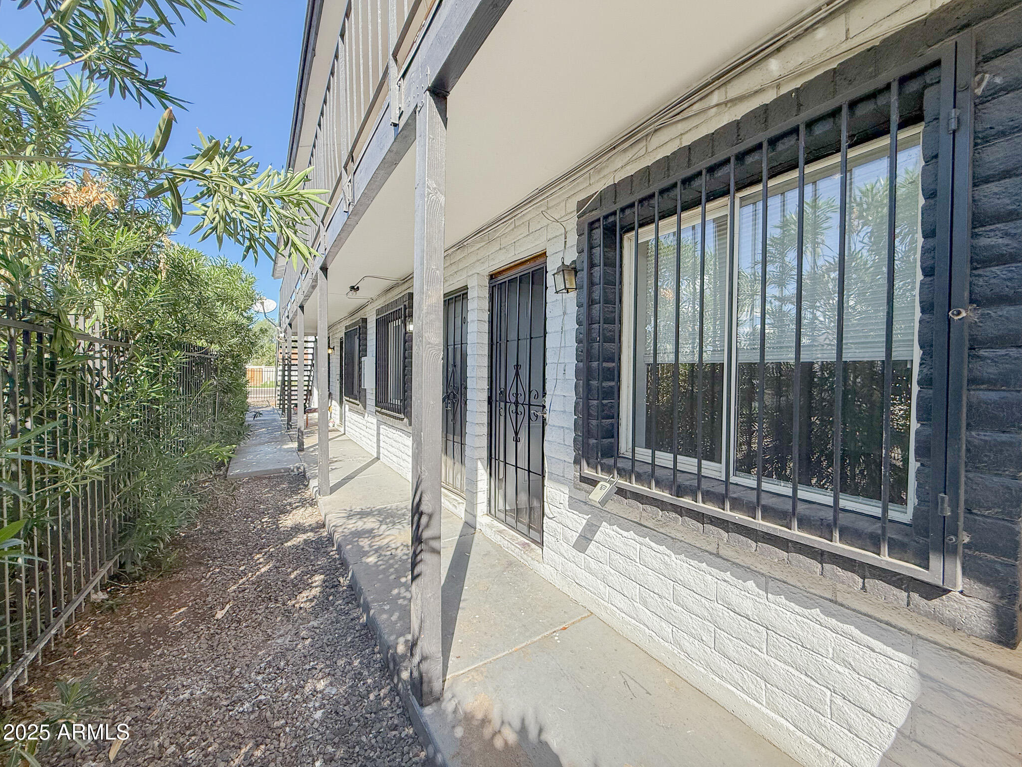 1703 West Mountain View Road, Unit 11 Phoenix, AZ 85021 - Photo 4 of 12 a view of a house with a garden