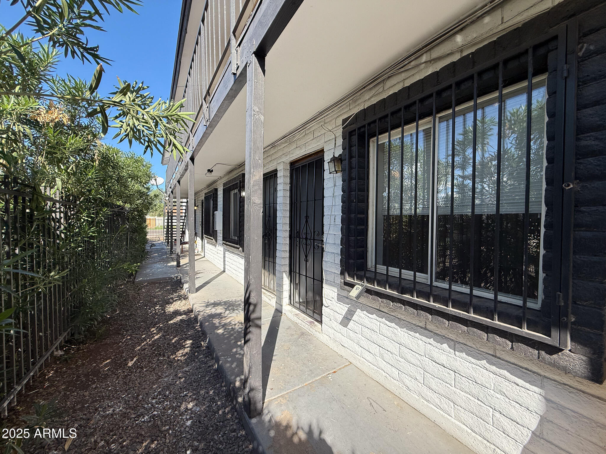 1703 West Mountain View Road, Unit 11 Phoenix, AZ 85021 - Photo 5 of 12 a view of backyard with porch