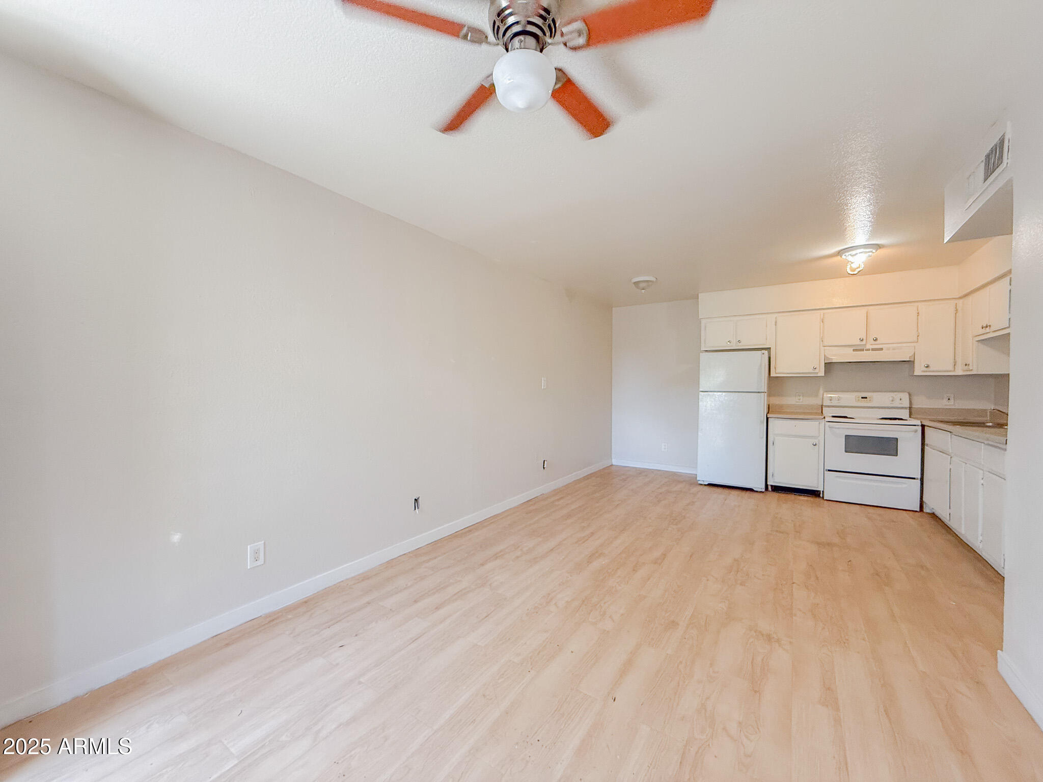 1703 West Mountain View Road, Unit 11 Phoenix, AZ 85021 - Photo 7 of 12 a view of a kitchen with a sink and cabinets