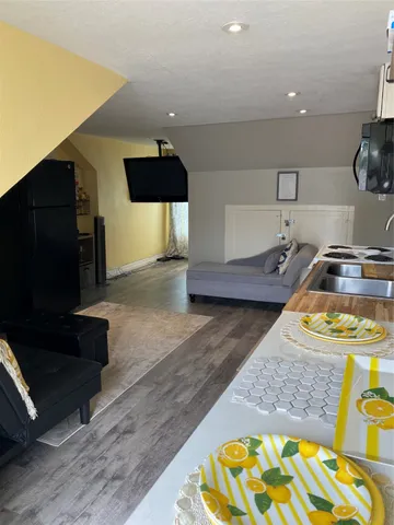 a kitchen with stainless steel appliances granite countertop a sink and a stove