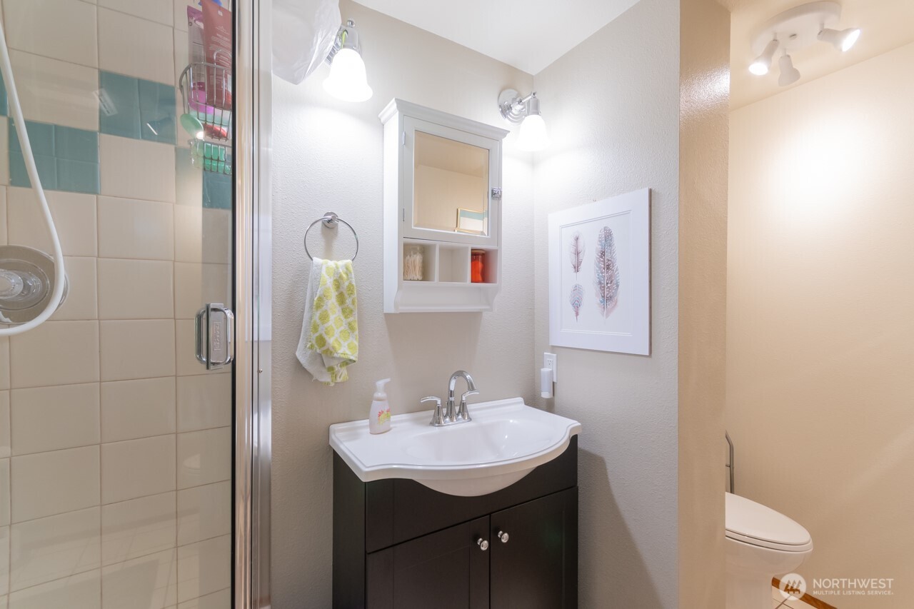 492 Walkabout Way Port Angeles, WA 98363 - Photo 34 of 40 a bathroom with a sink a toilet and mirror