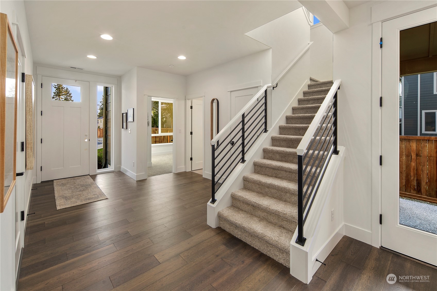 105 179th Place Southwest Bothell, WA 98012 - Photo 11 of 24 a view of entryway with wooden floor and stairs