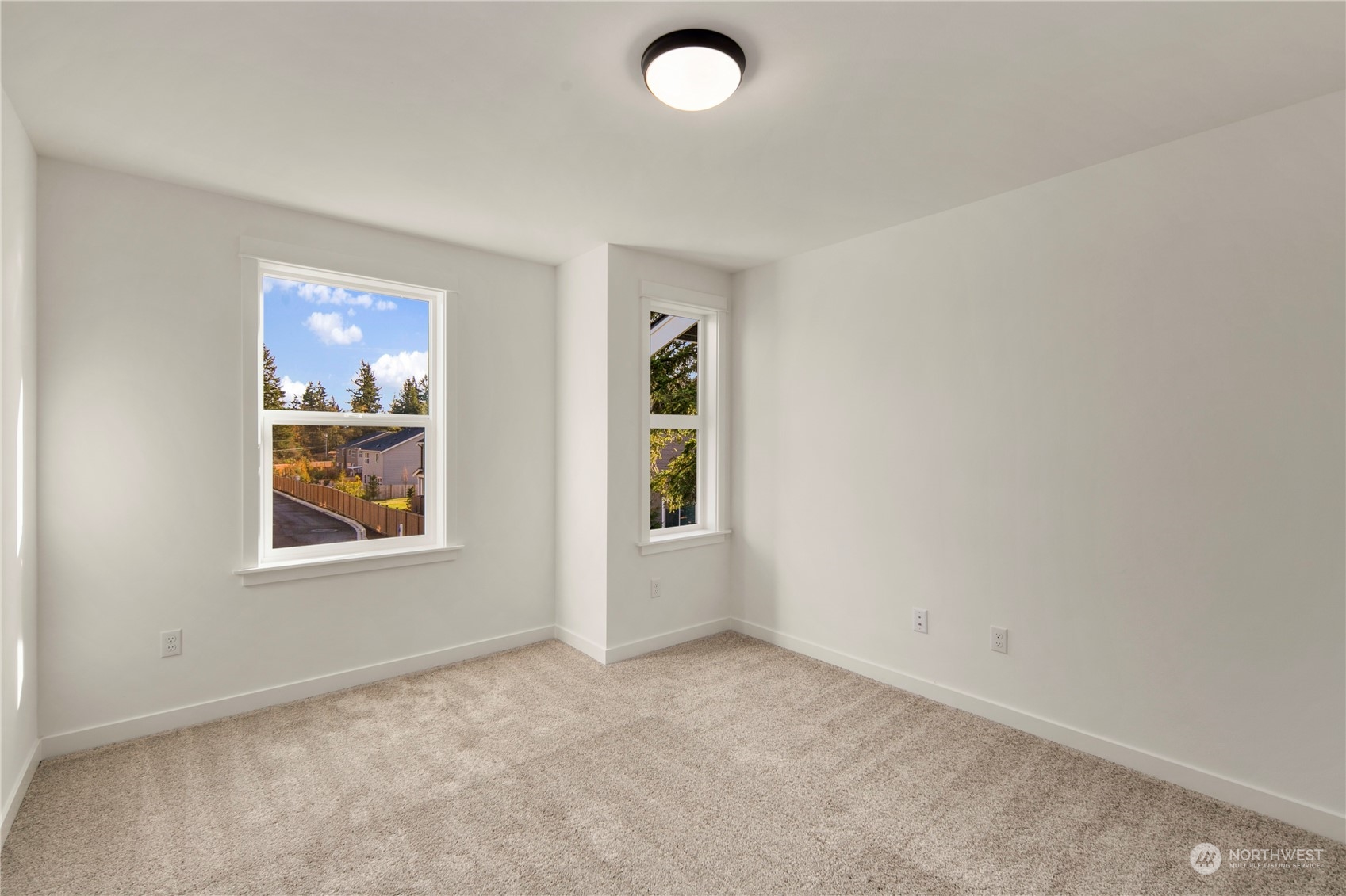 105 179th Place Southwest Bothell, WA 98012 - Photo 21 of 24 an empty room with windows and painted walls
