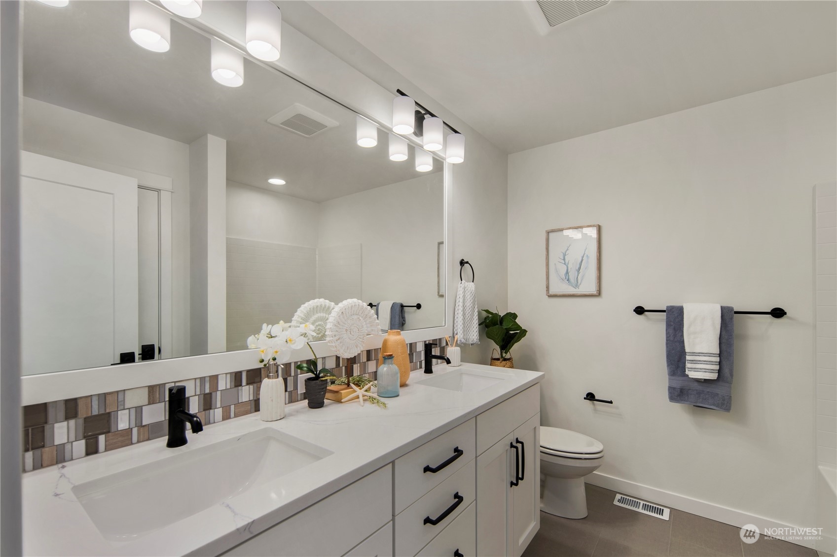 105 179th Place Southwest Bothell, WA 98012 - Photo 22 of 24 a bathroom with a double vanity sink mirror and toilet