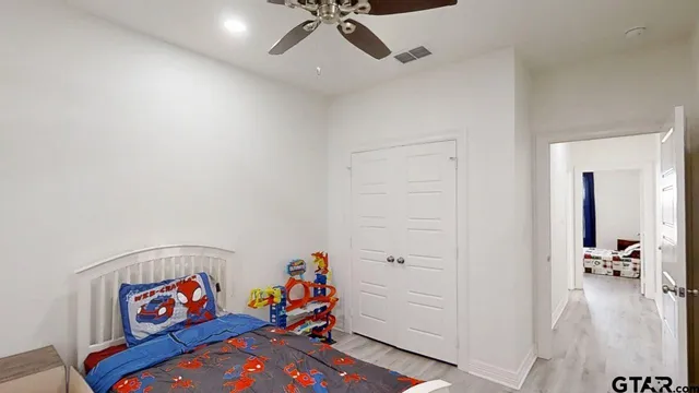 a hallway with toys and a chandelier
