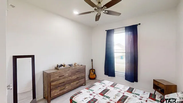 a bed room with a bed and a window