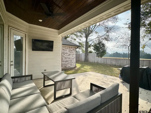 a view of swimming pool with seating area