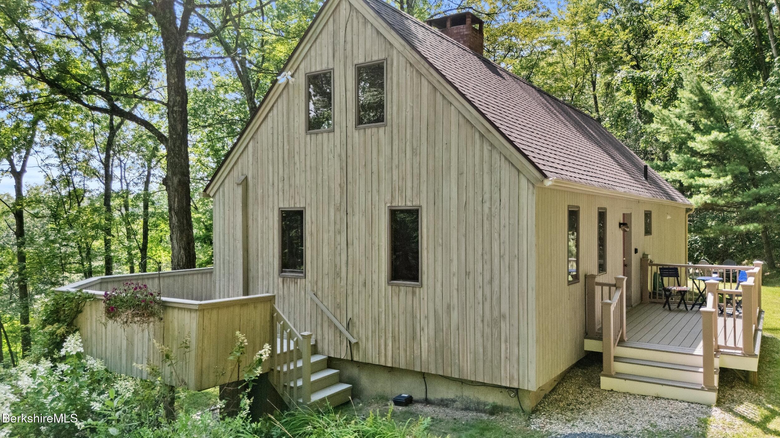 85 Main Road Monterey, MA 01230 - Photo 11 of 32 a view of a back yard of the house