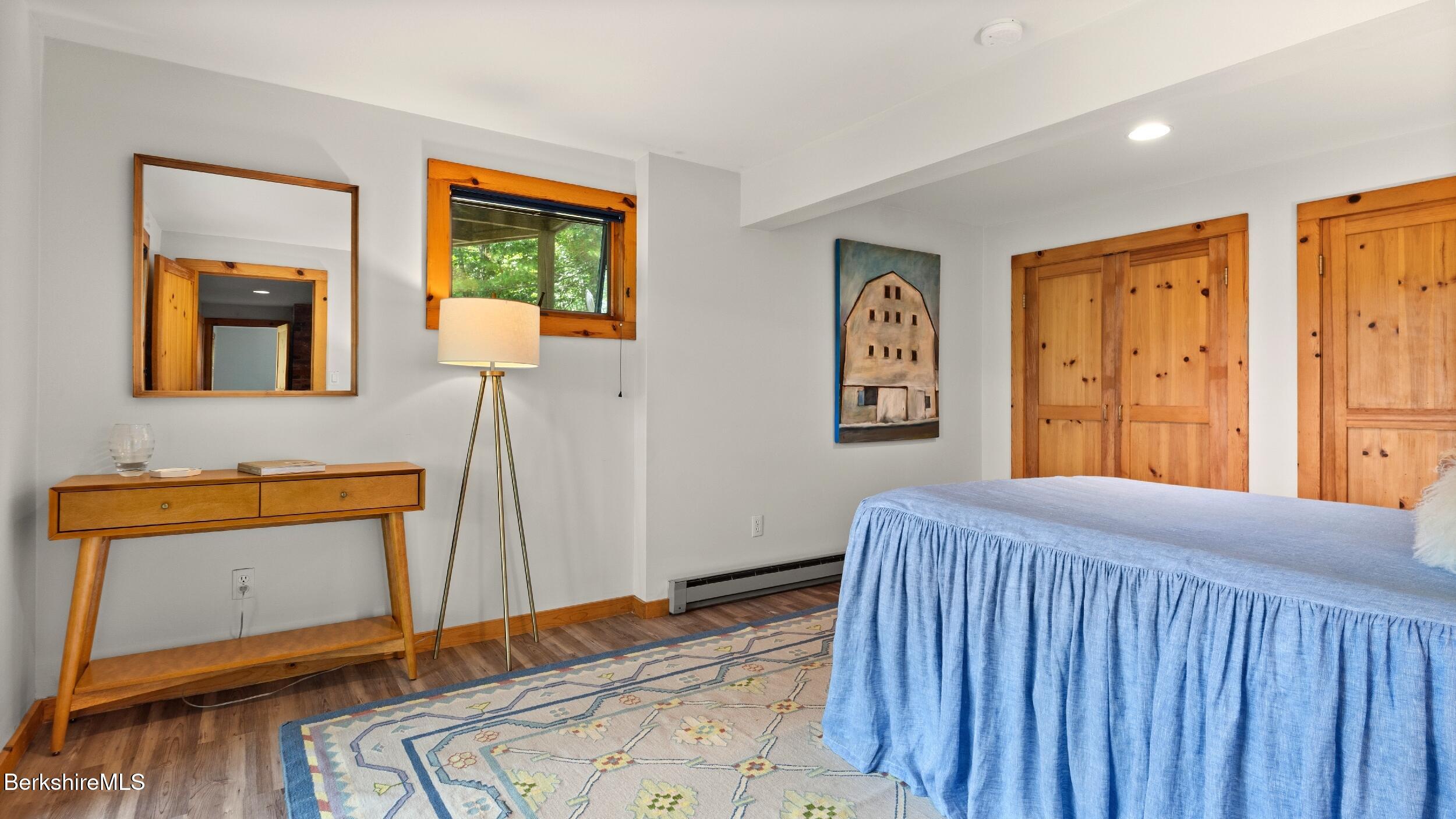 85 Main Road Monterey, MA 01230 - Photo 13 of 32 a bedroom with a bed and wooden floor