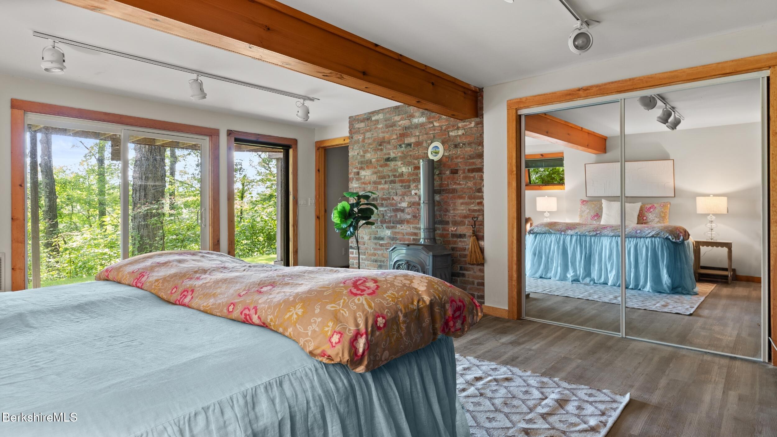 85 Main Road Monterey, MA 01230 - Photo 17 of 32 a bedroom with a bed and large window with balcony view