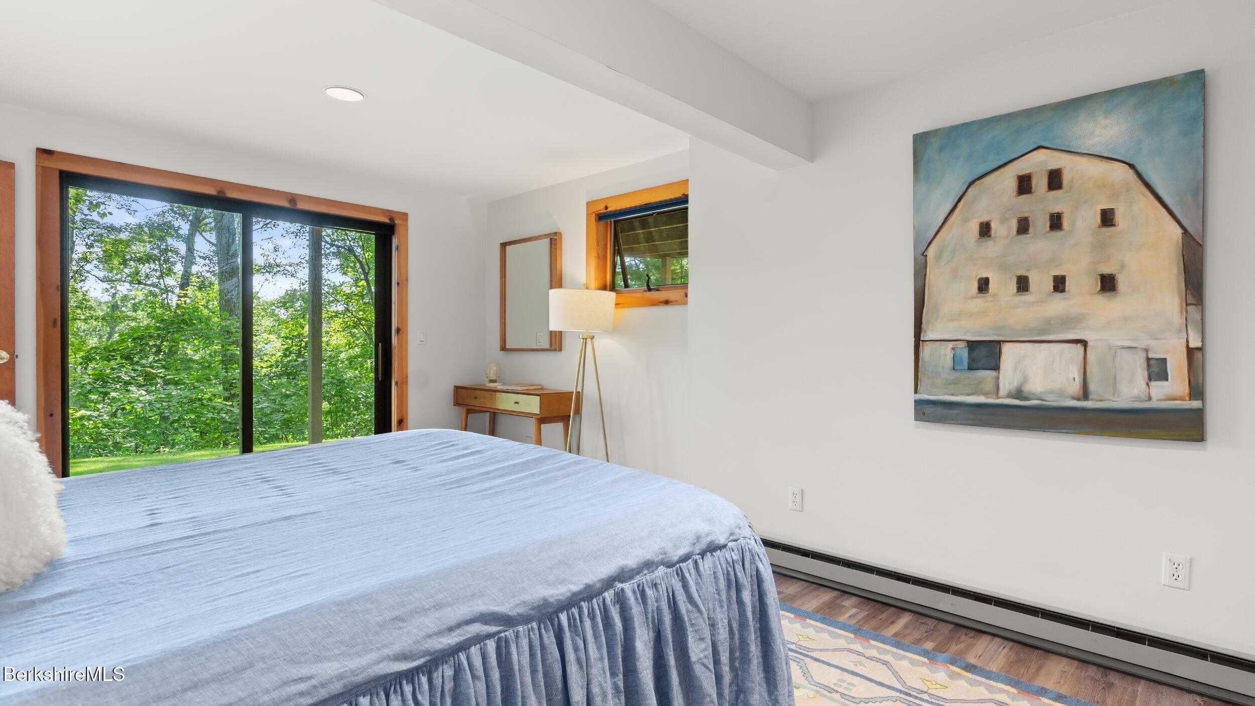 85 Main Road Monterey, MA 01230 - Photo 18 of 32 a bed sitting in a bedroom next to a window