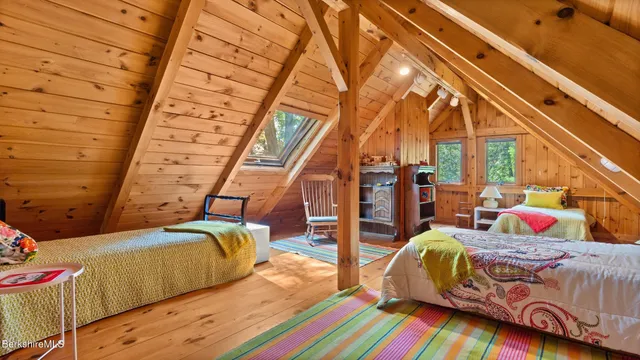 a bedroom with bed and a walk in closet