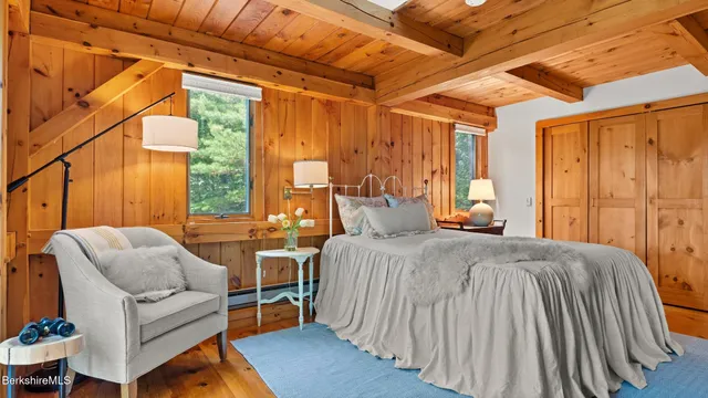 a spacious bedroom with a bed and a couch