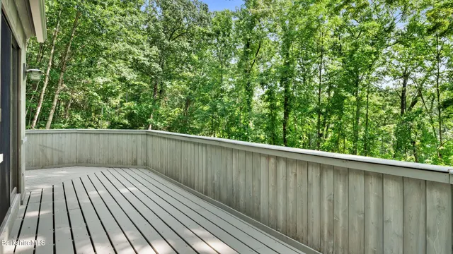 a balcony with wooden floor