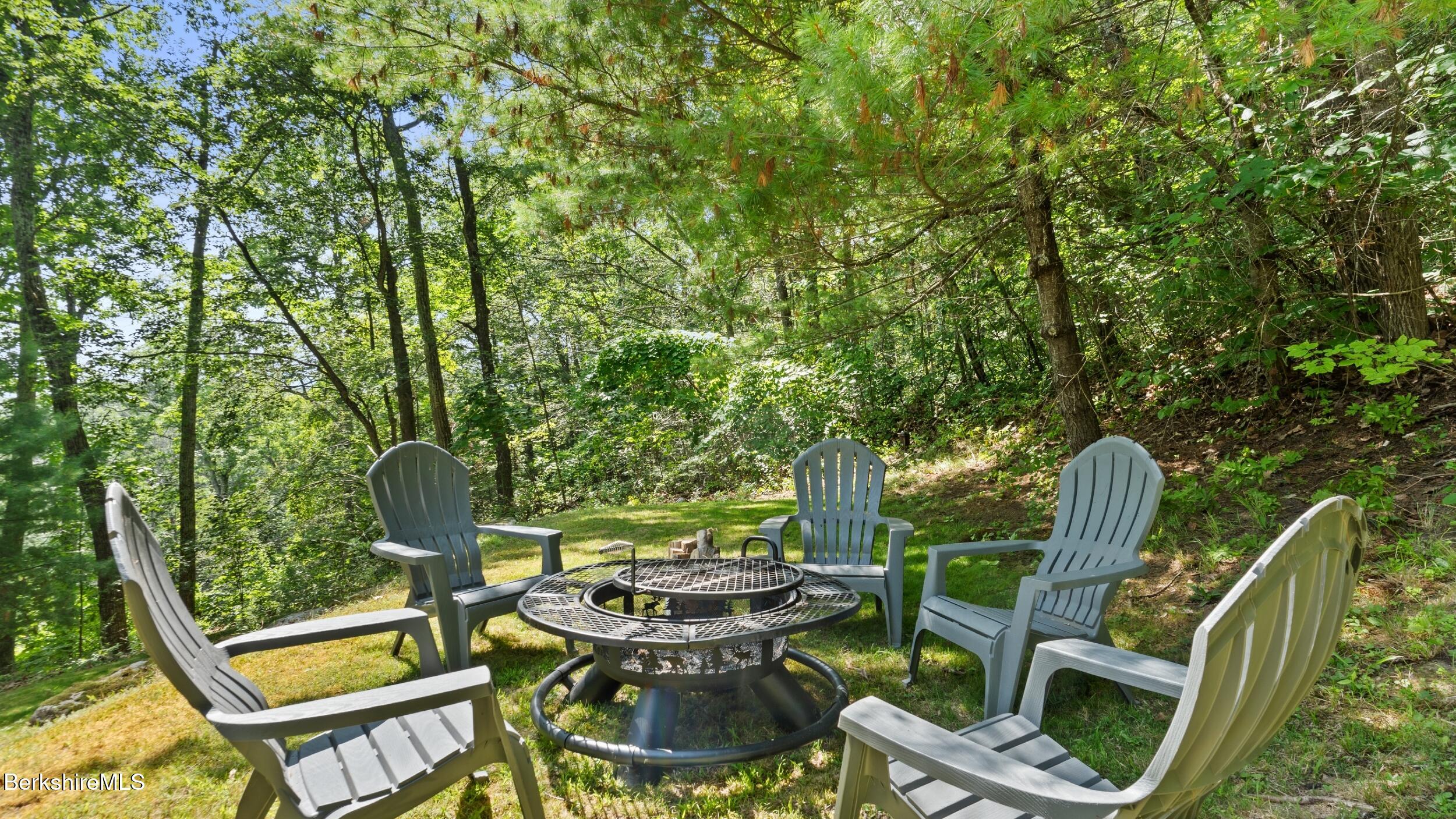 85 Main Road Monterey, MA 01230 - Photo 31 of 32 a view of backyard with patio and outdoor seating