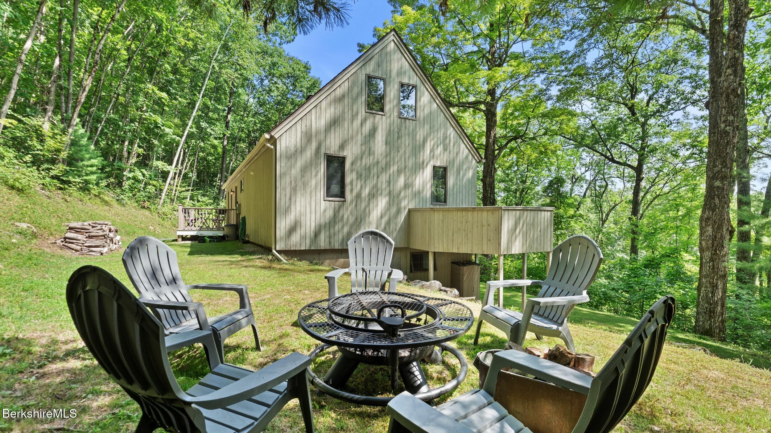 85 Main Road Monterey, MA 01230 - Photo 5 of 32 a view of backyard of house and seating space