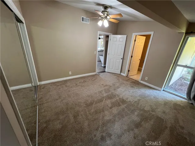 a view of a big room with window and hardwood floor