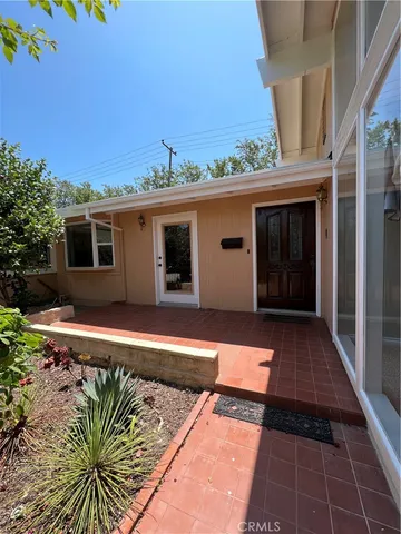 a view of backyard with patio