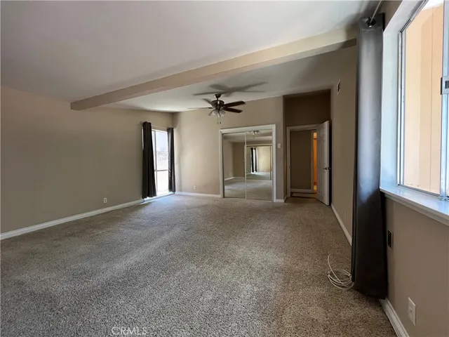 a view of a hallway with windows