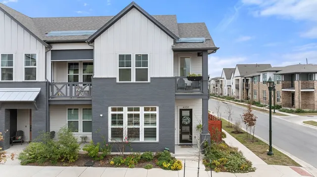 a front view of a house with glass windows