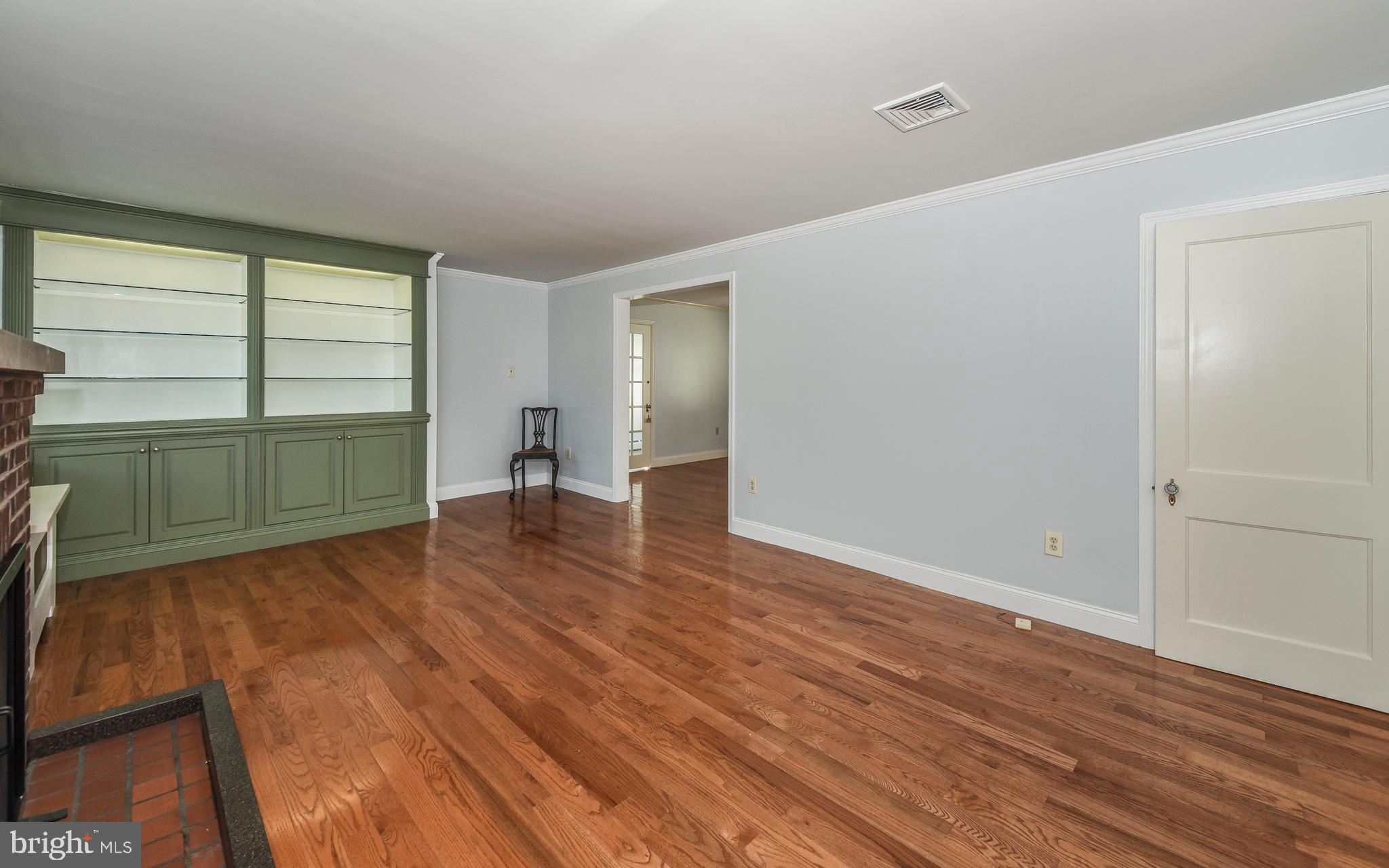 3 Erdenheim Road Glenside, PA 19038 - Photo 4 of 35 Living room with custom , lighted cabinetry.