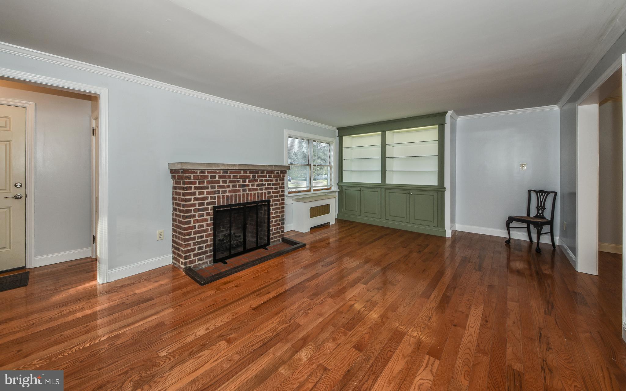 3 Erdenheim Road Glenside, PA 19038 - Photo 6 of 35 Traditional styled brick wood burning fireplace.