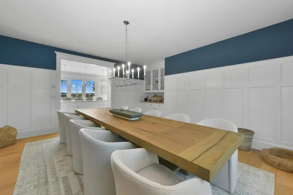 a view of a dining room furniture and chandelier