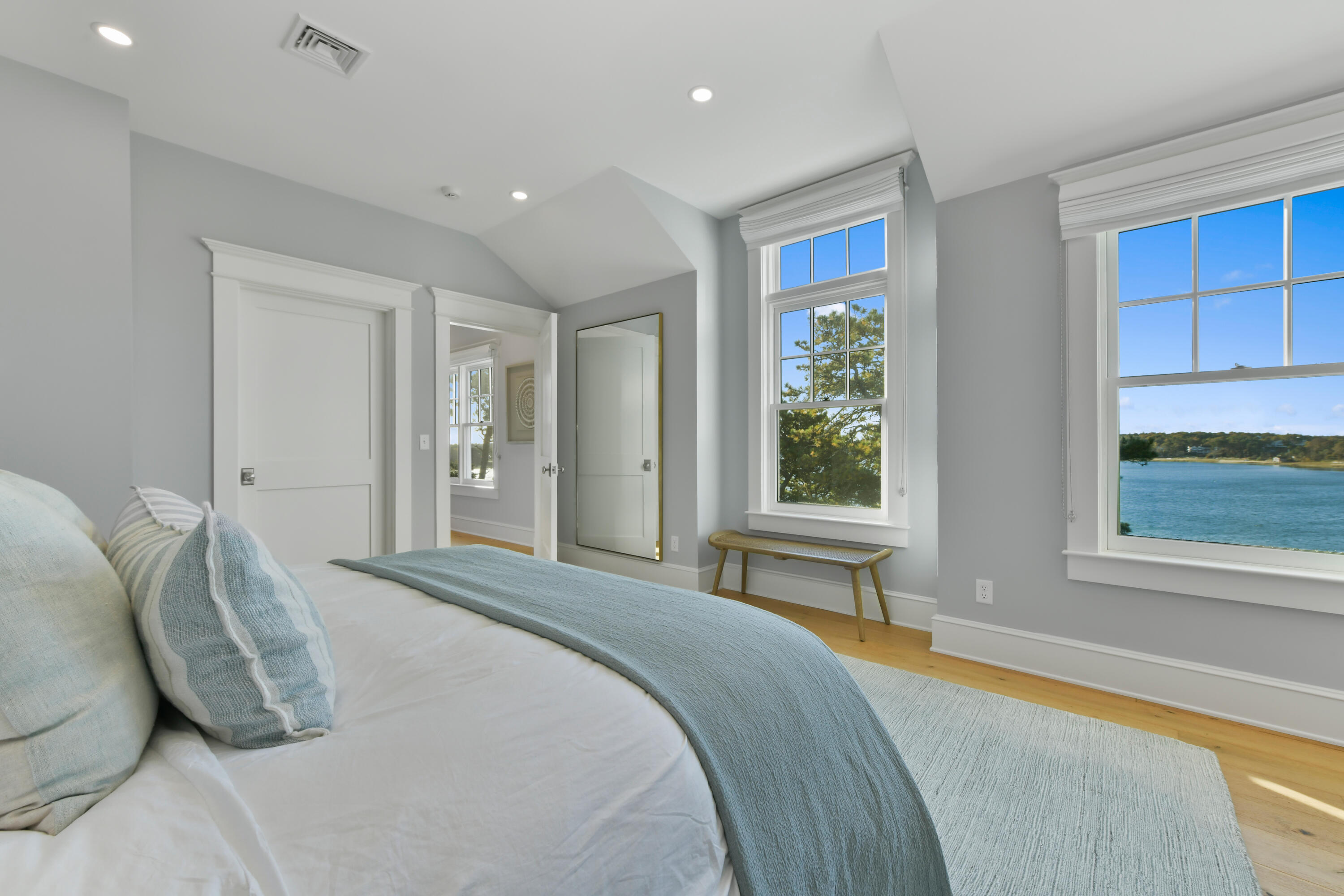 558 Fox Hill Road Chatham, MA 02633 - Photo 12 of 39 a spacious bedroom with a large bed and a large window