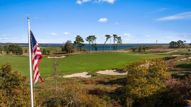 a view of a golf course with a lake