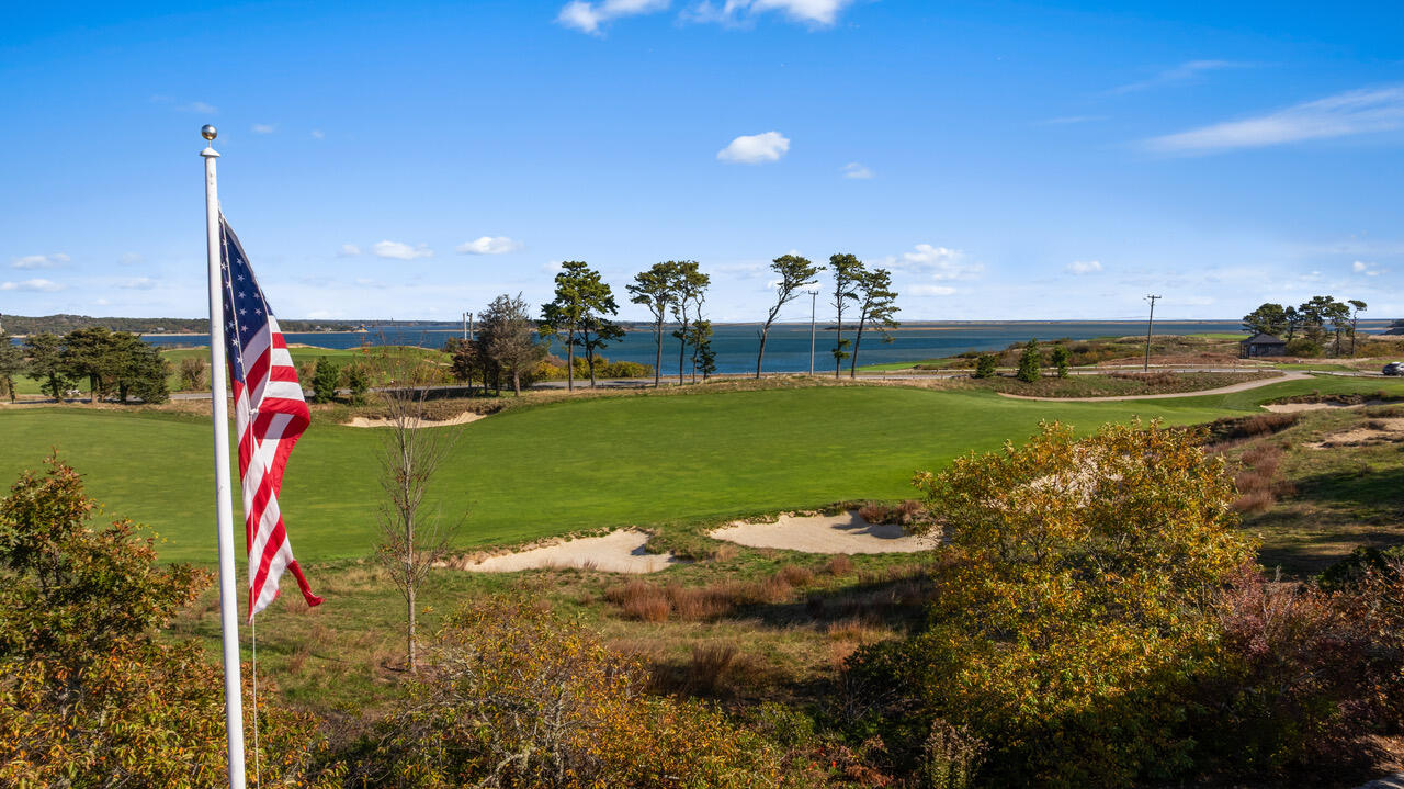 558 Fox Hill Road Chatham, MA 02633 - Photo 20 of 39 a view of a golf course with a lake