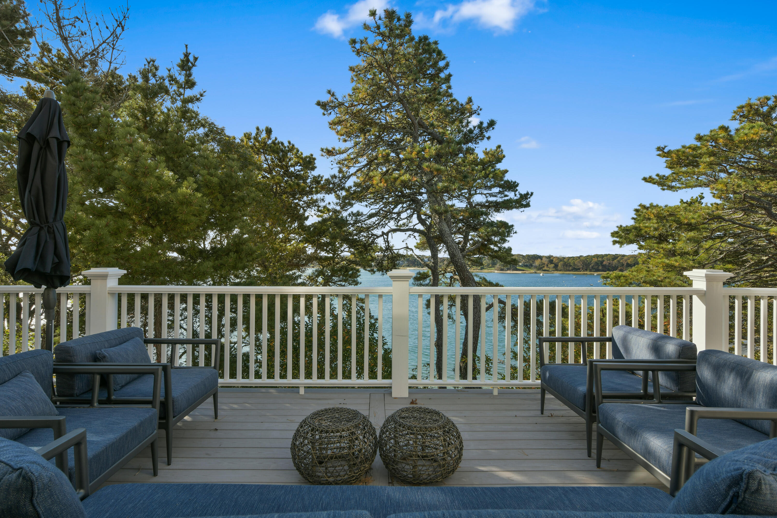 558 Fox Hill Road Chatham, MA 02633 - Photo 22 of 39 a balcony with wooden floor table and chairs