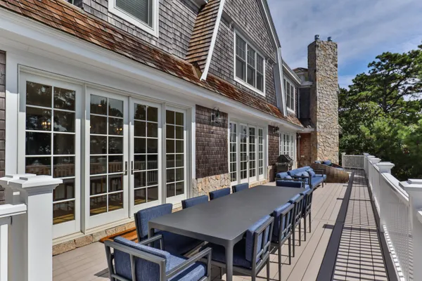 front view of a building with a table and chairs