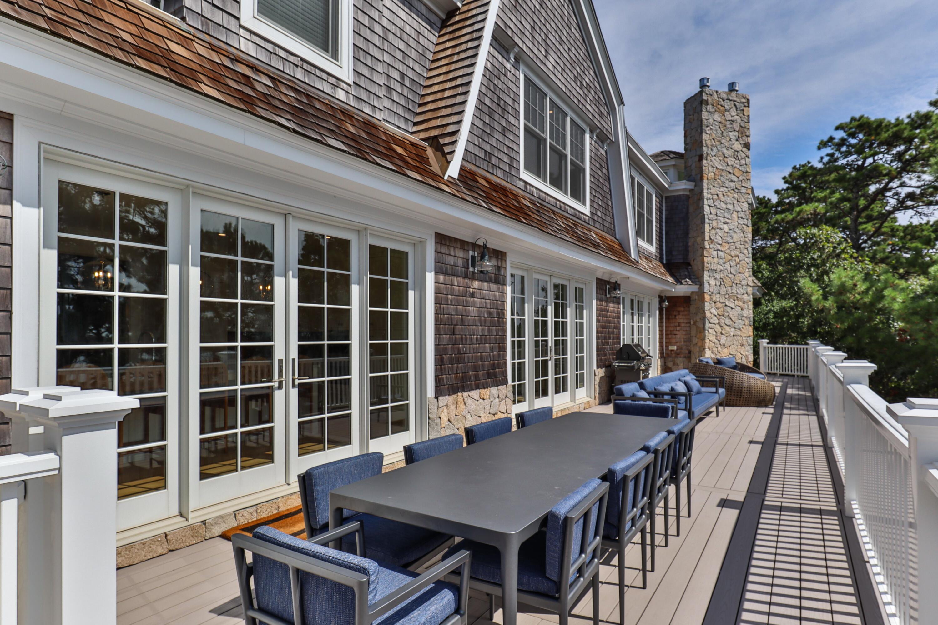 558 Fox Hill Road Chatham, MA 02633 - Photo 23 of 39 front view of a building with a table and chairs
