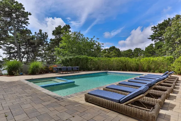 a view of a backyard with sitting area