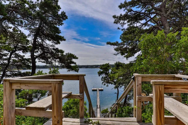 front view of a house with a tree