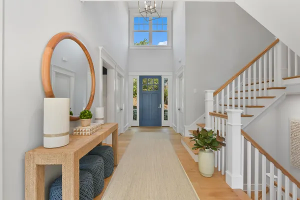 a view of entryway and hall with wooden floor