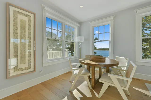 a view of a dining room with furniture window and outside view